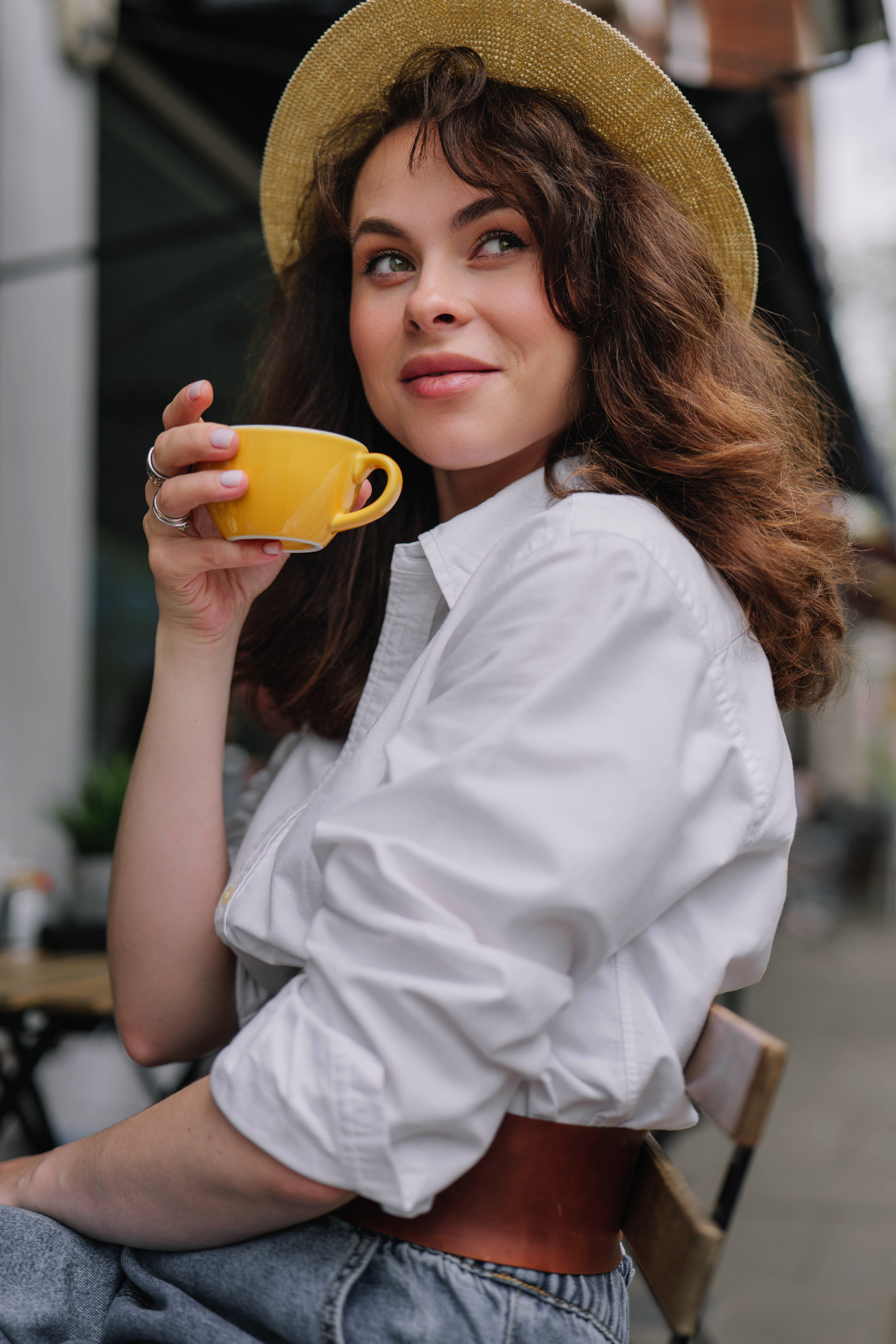 Stylish beautiful woman with a cup of coffee