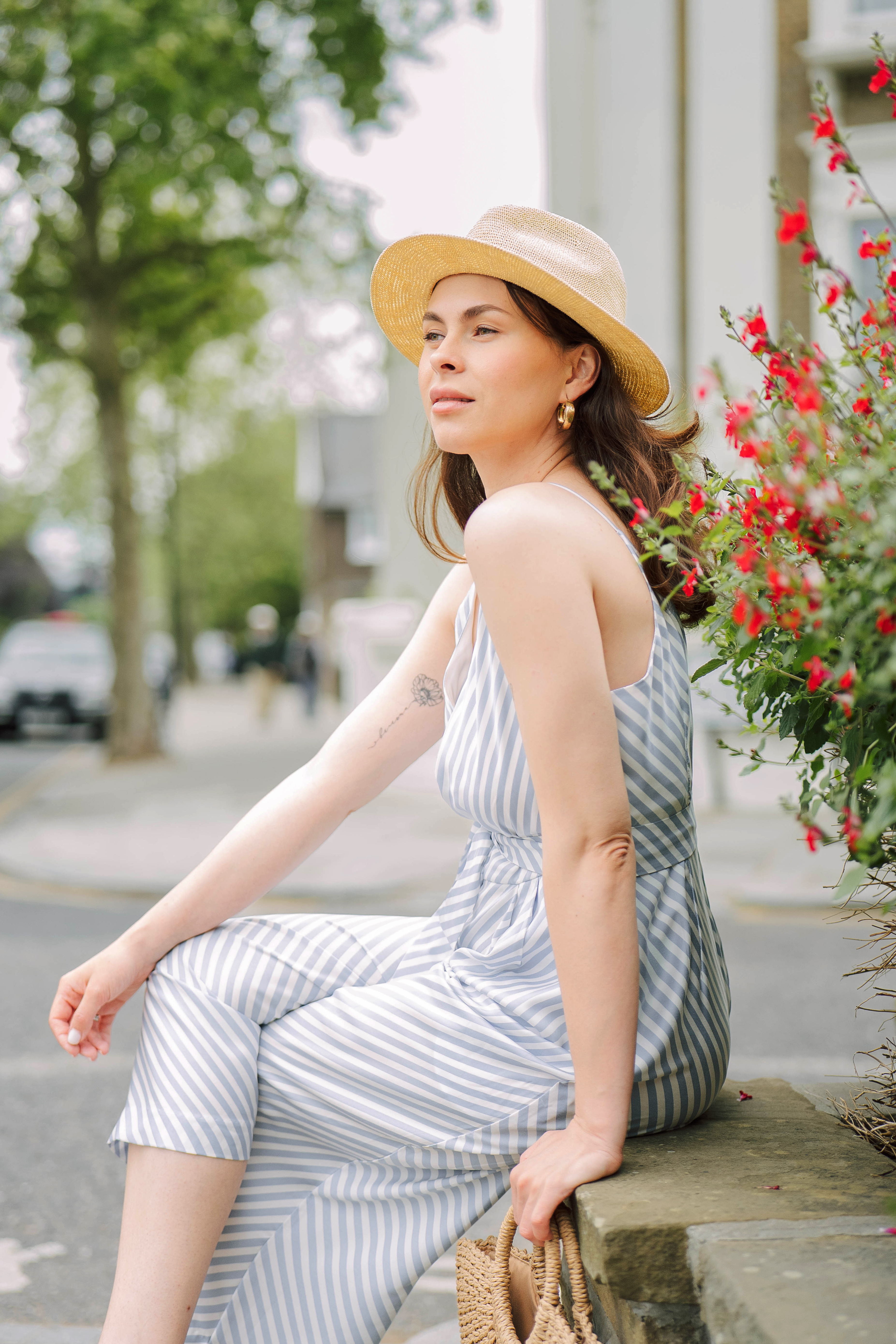 Summer photoshoot of a woman in hat