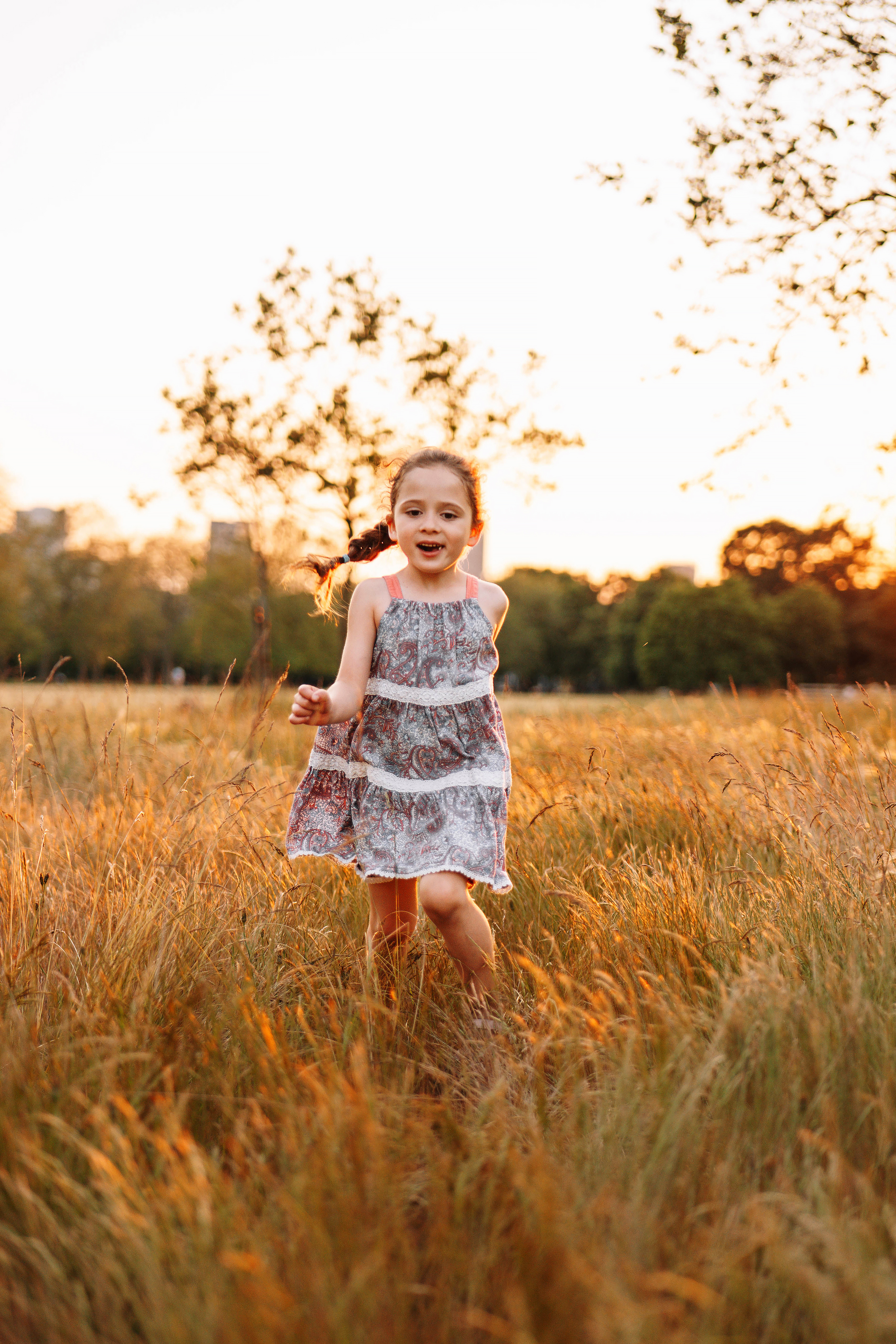 small girl photoshoot in the field, sunset