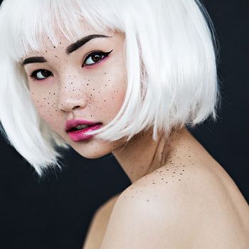 studio portrait in London of an asian girl with white hair